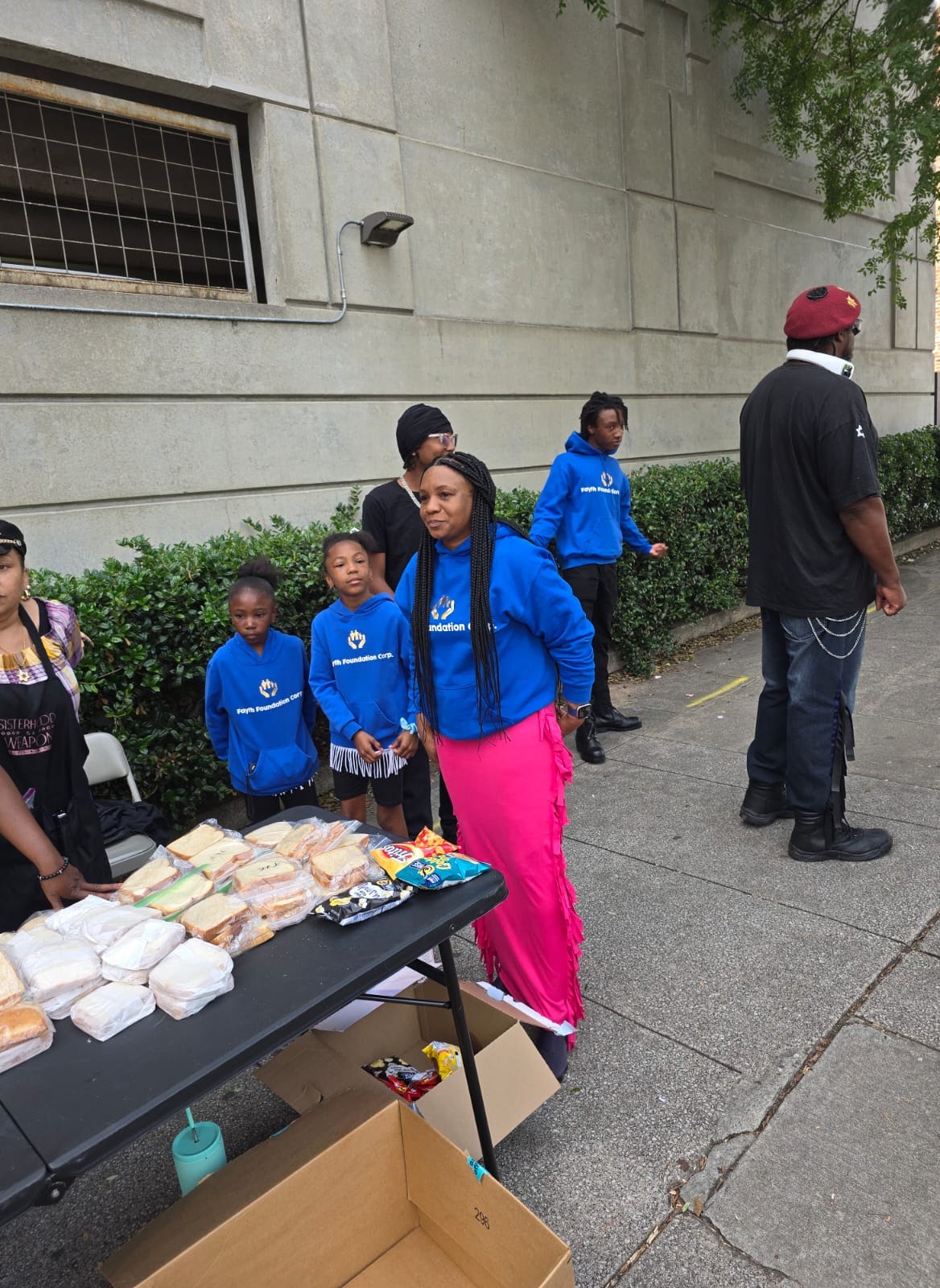 Volunteers with boxes of food at a community event